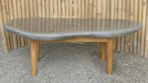 Product image of the product “table made of riverstone with wooden feet. size approx. 118x81,5x38 cm ”